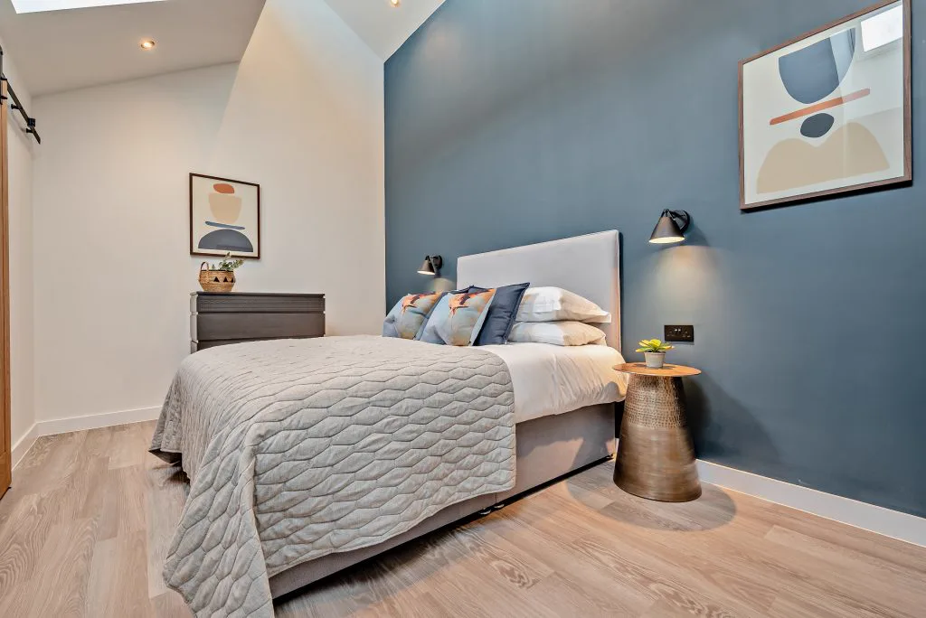 Arvor Suite bedroom — calm, modern interior with natural light and coastal views