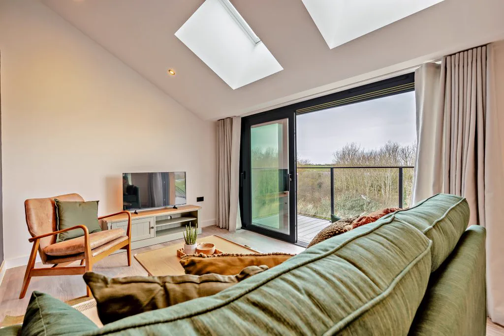 Arvor Suite interior — modern self-catering suite with coastal light and countryside views at Whalesborough