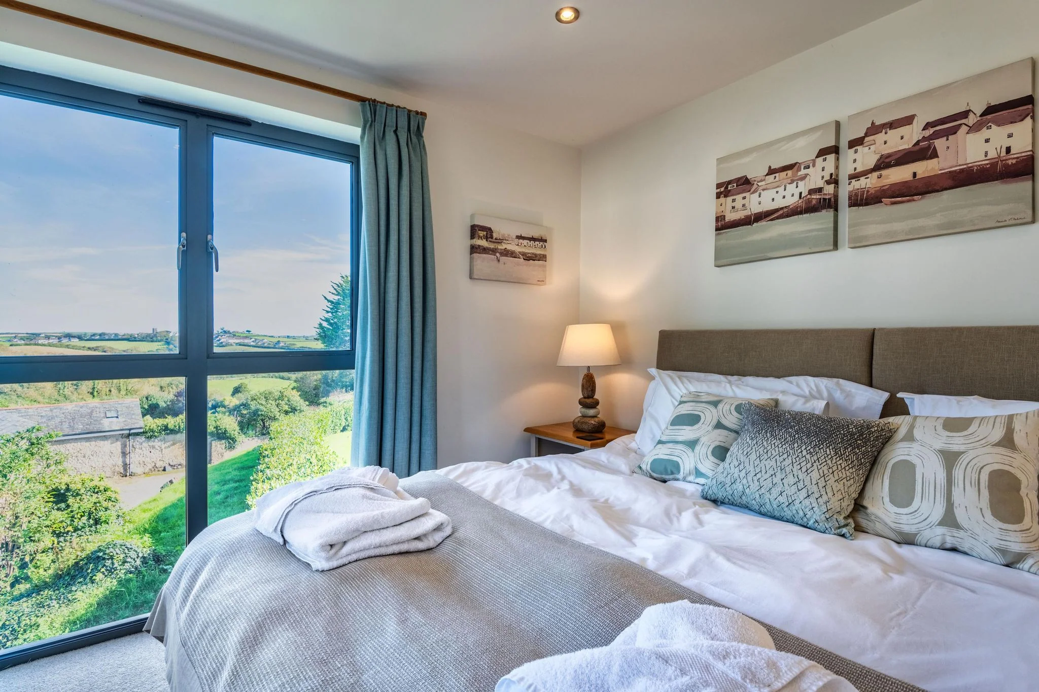 Arundell bedroom with large windows and countryside views