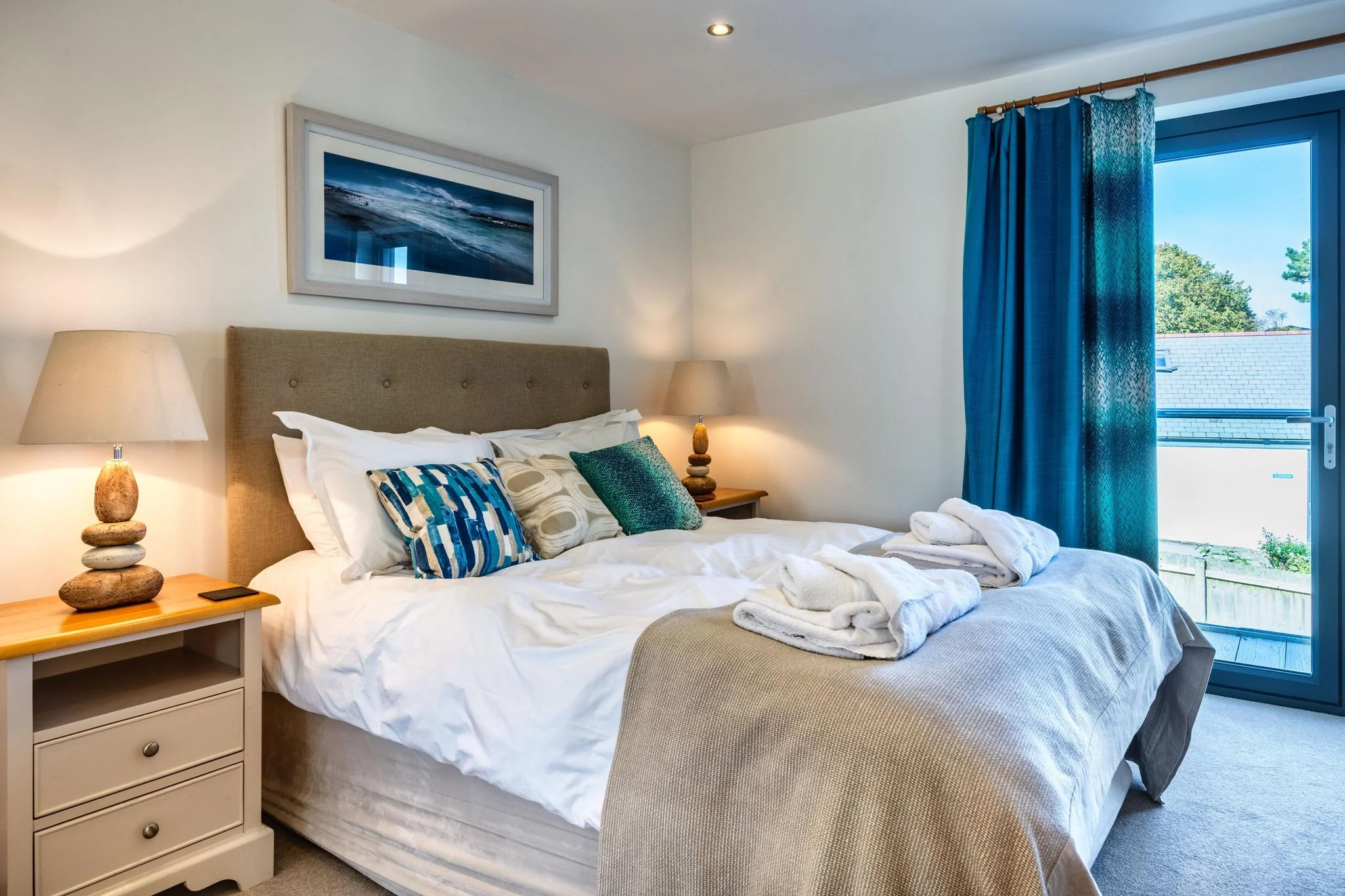 Arundell master bedroom with coastal-toned decor