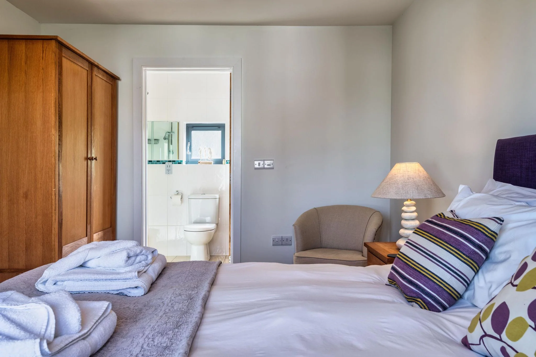 Venners master bedroom with wardrobe and open doorway leading through to the en-suite shower room.