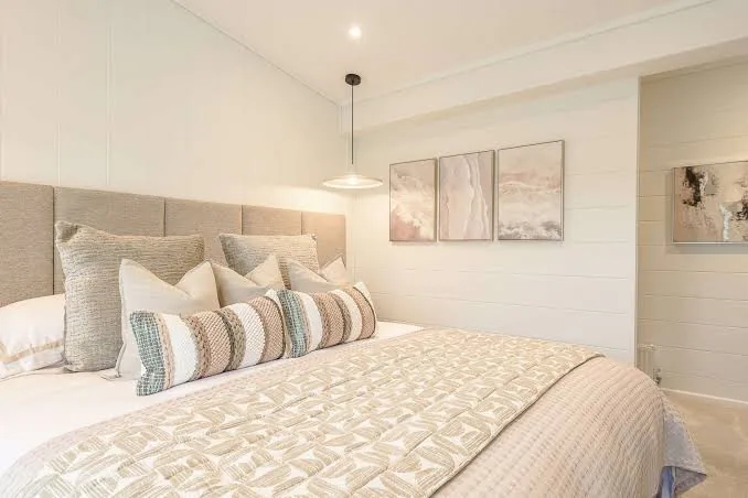 Principal bedroom of the three-bedroom Gwithva Prestige Skylark, with an upholstered headboard