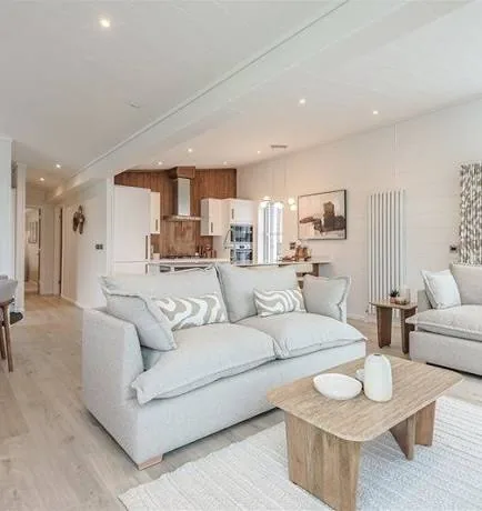 Lounge of the three-bedroom Gwithva Prestige Skylark, looking through to the kitchen